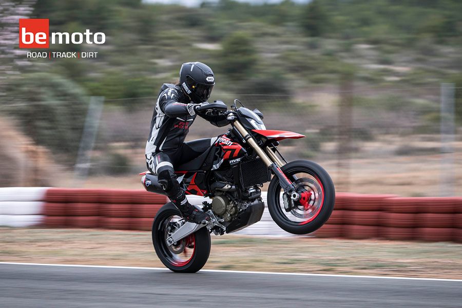 Chris Northover sit down wheelie on track with a Ducati Hypermotard 698 Mono