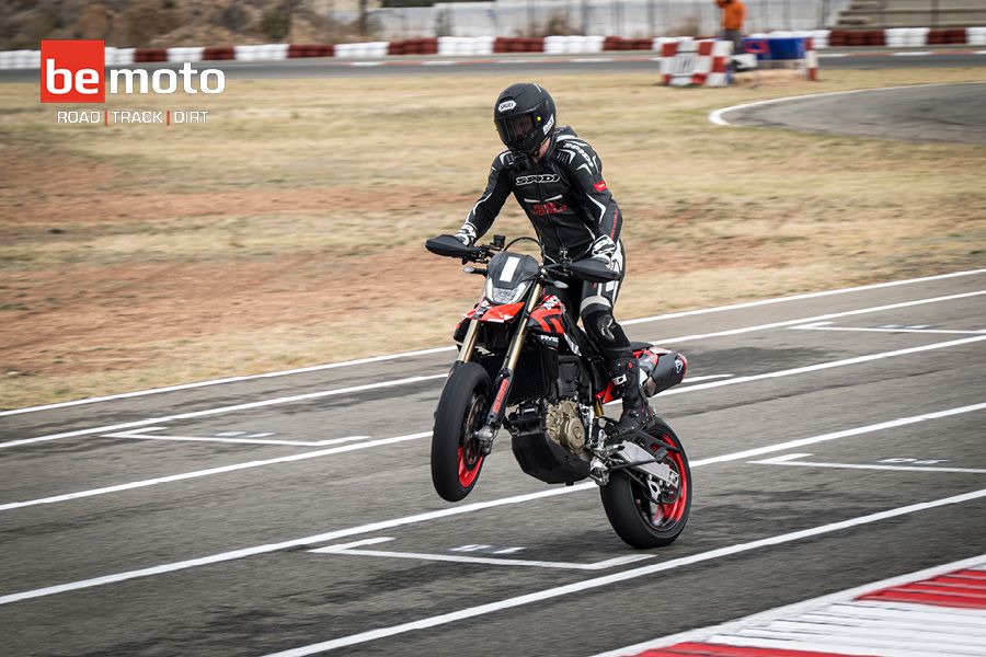 Chris Northover stand up wheelie on track with a Ducati Hypermotard 698 Mono