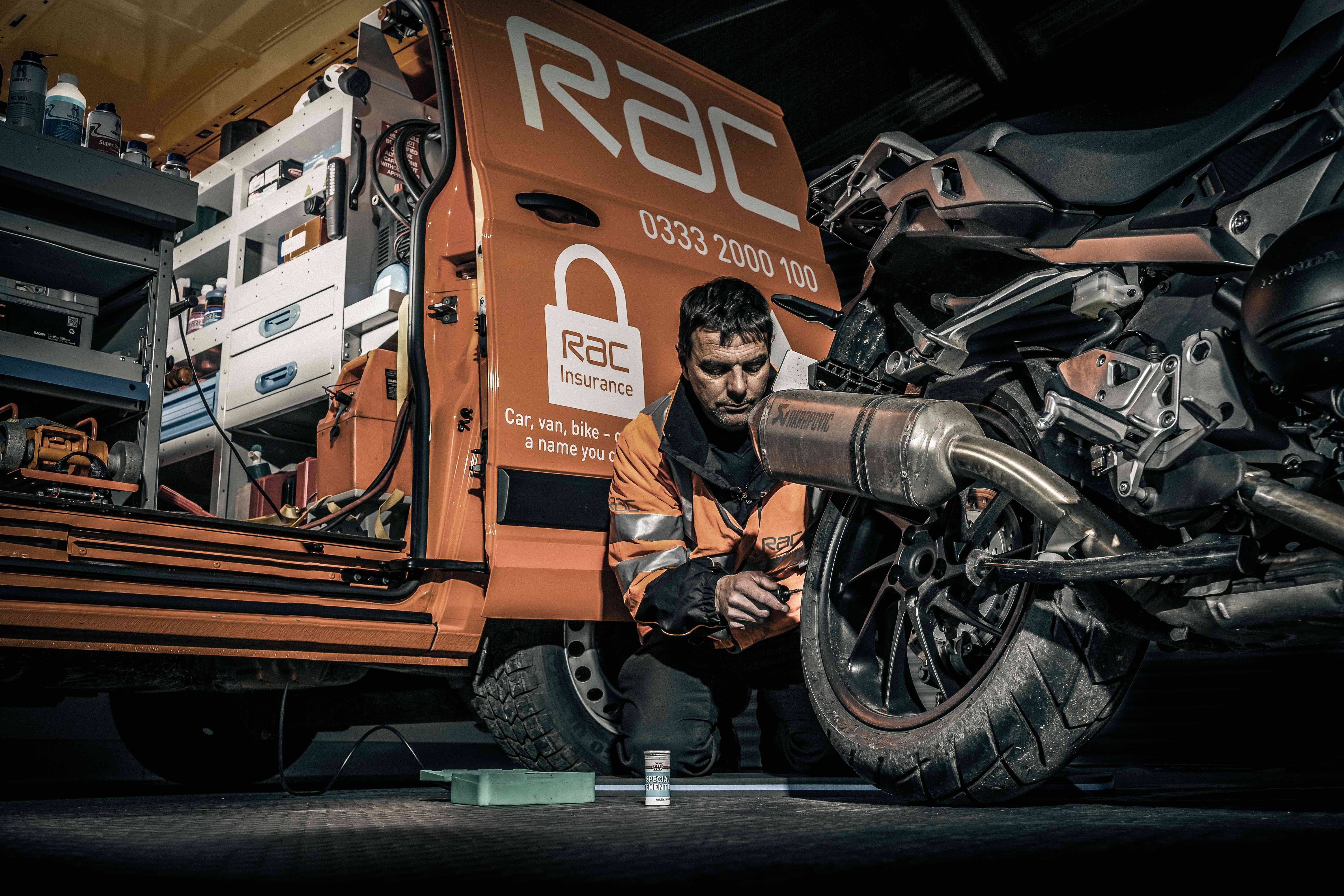 RAC van with man repairing a motorcycle