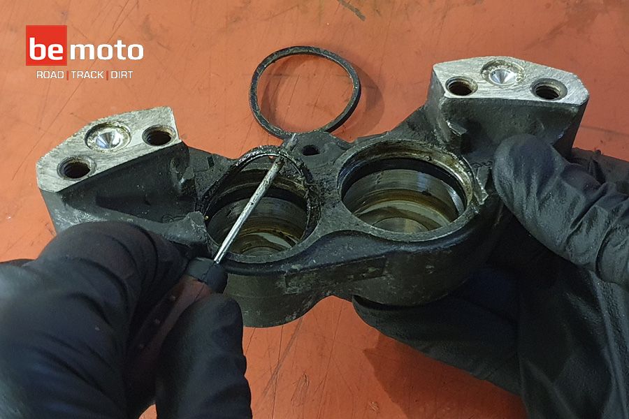 Removing the seals from a motorcycle brake calliper